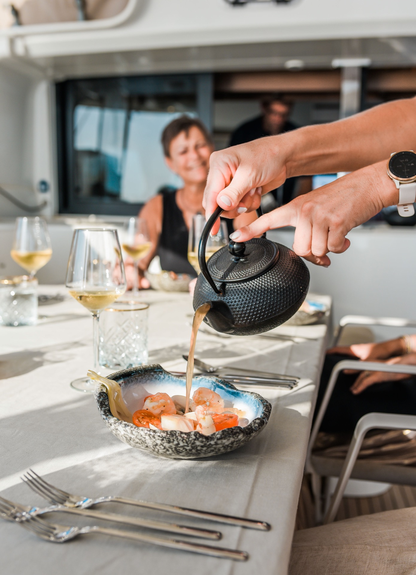 Fine dining set up on board at sunset