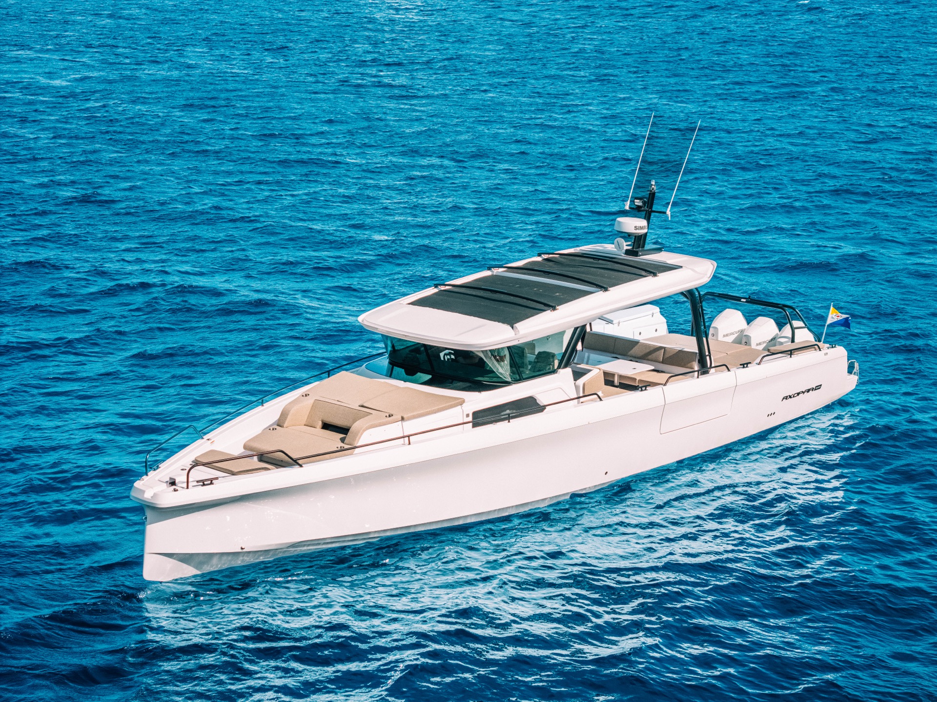 Axopar 45 motor yacht cruising the coastline